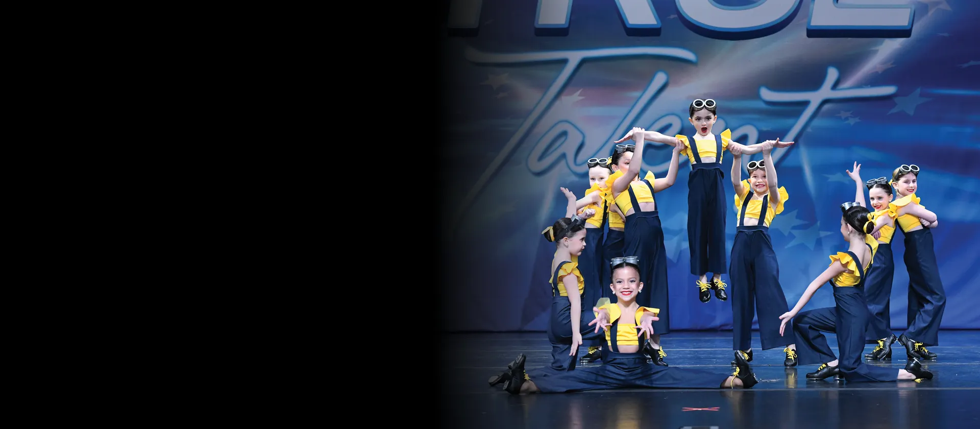 Young ICON dancers performing together on stage