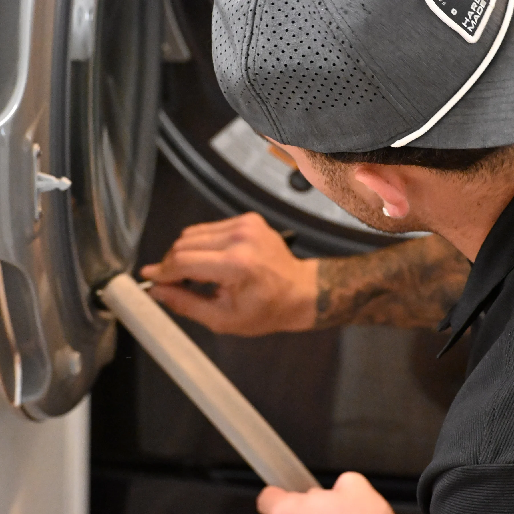 Amore technician working behind a dryer