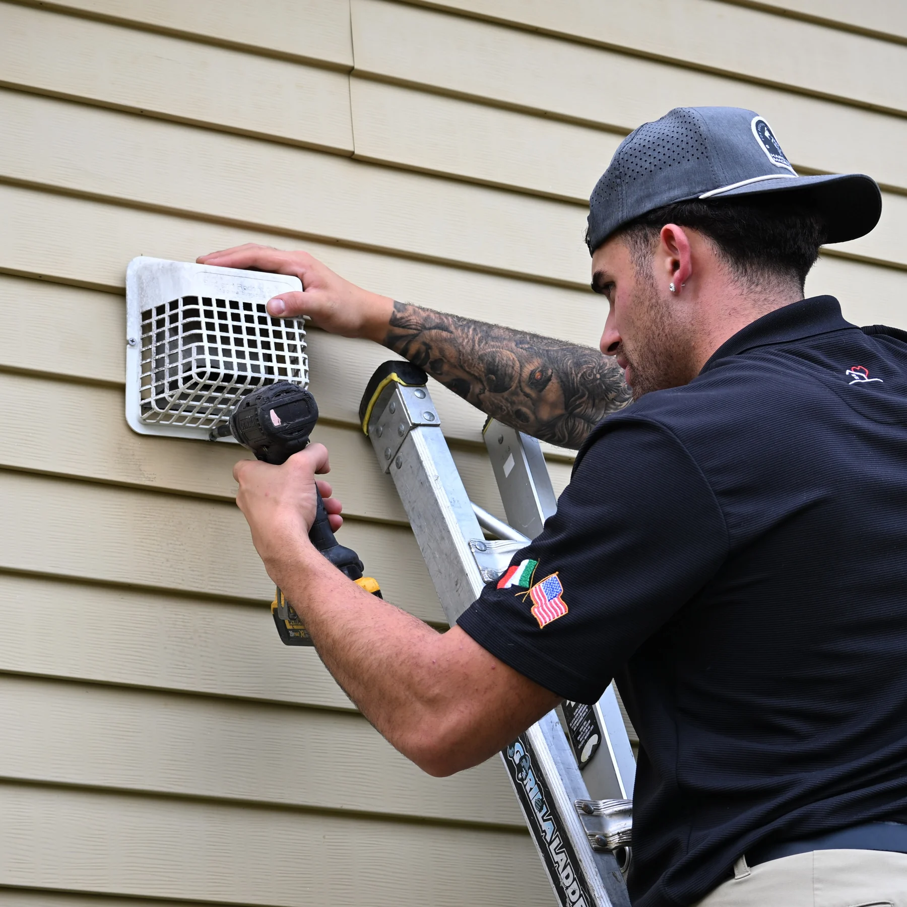Amore technician working on a dryer vent