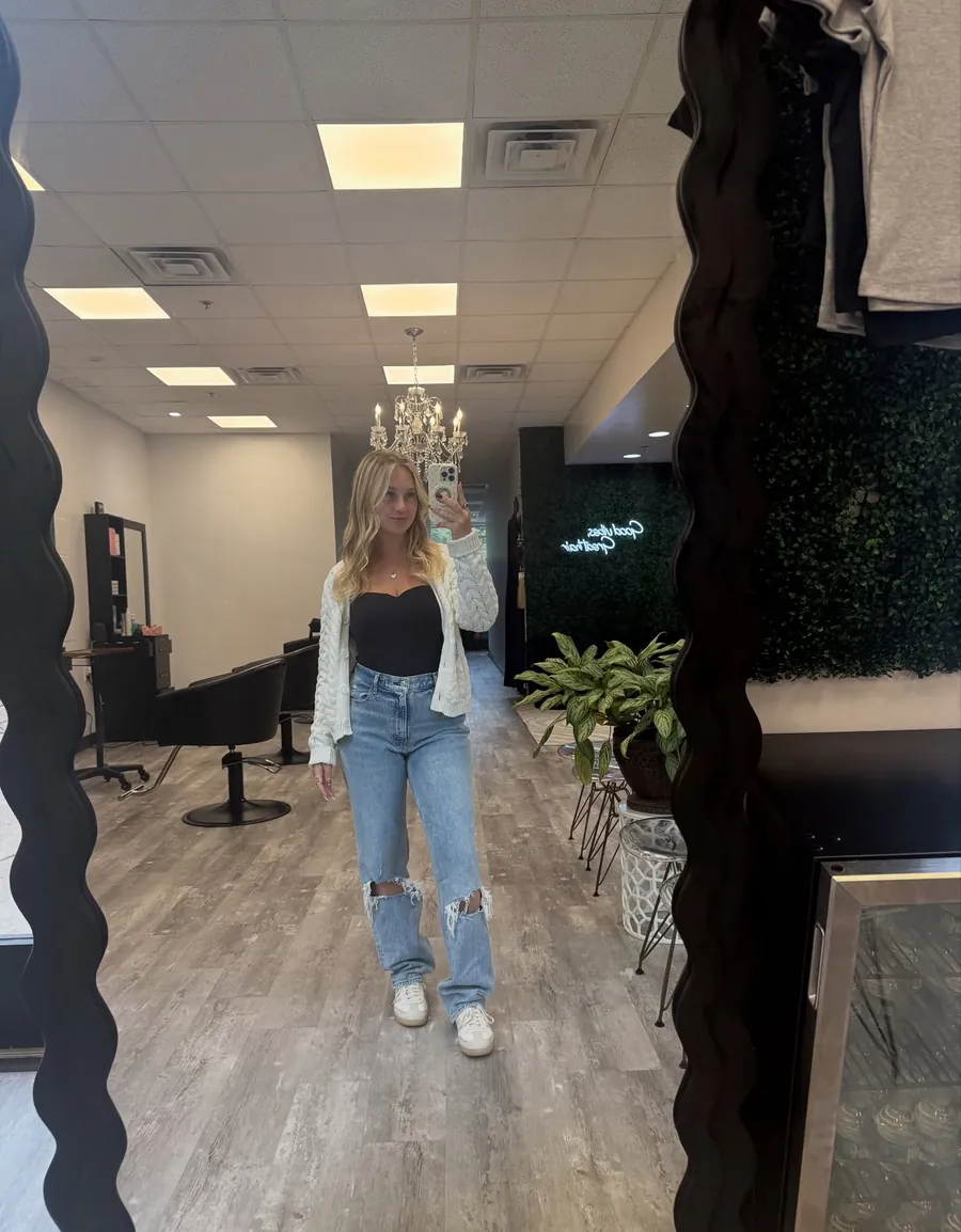 Carly in the wavy mirror on the studio floor